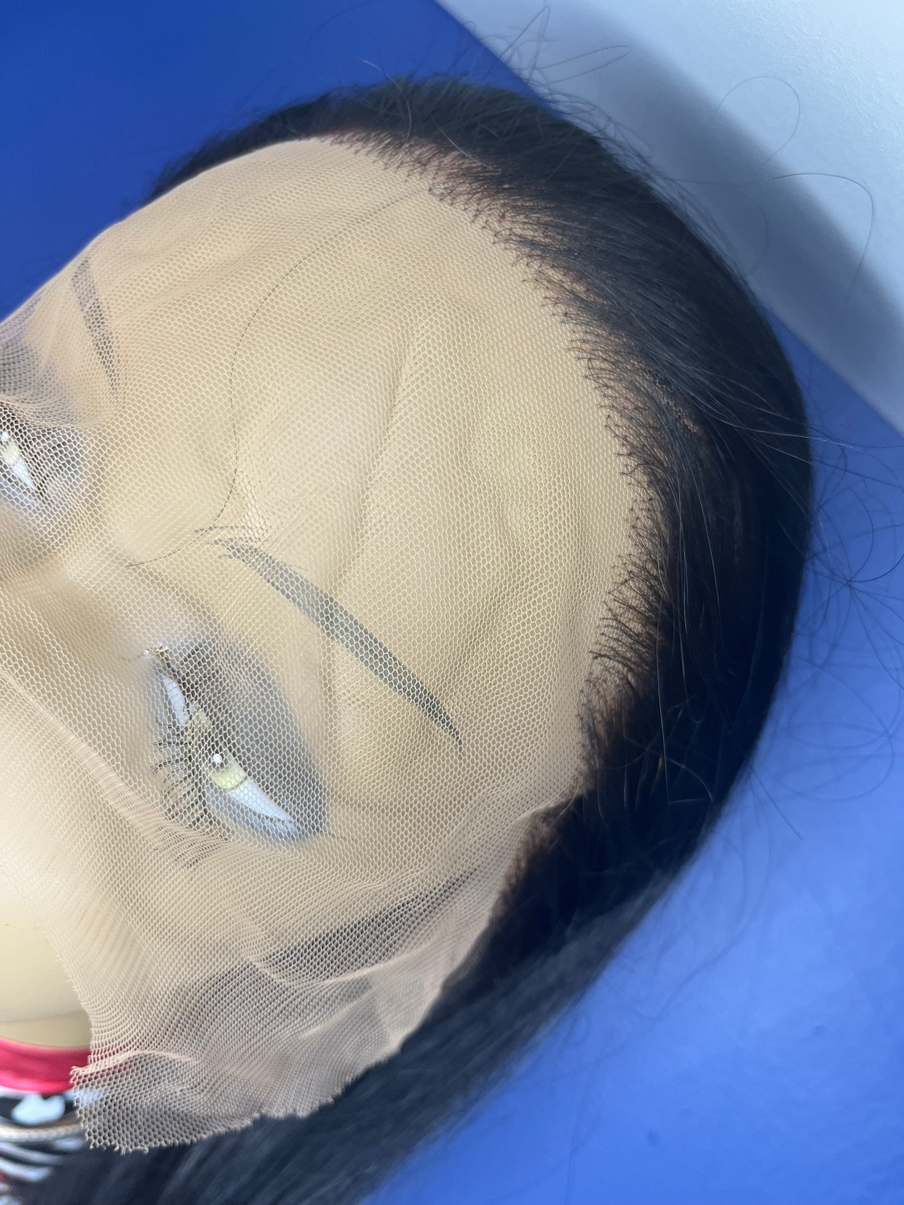 28 inch 13 by 4 preplucked prebleached gluless lace wig 100% human virgin Indian hair on mannequin sitting on white shelf with blue background