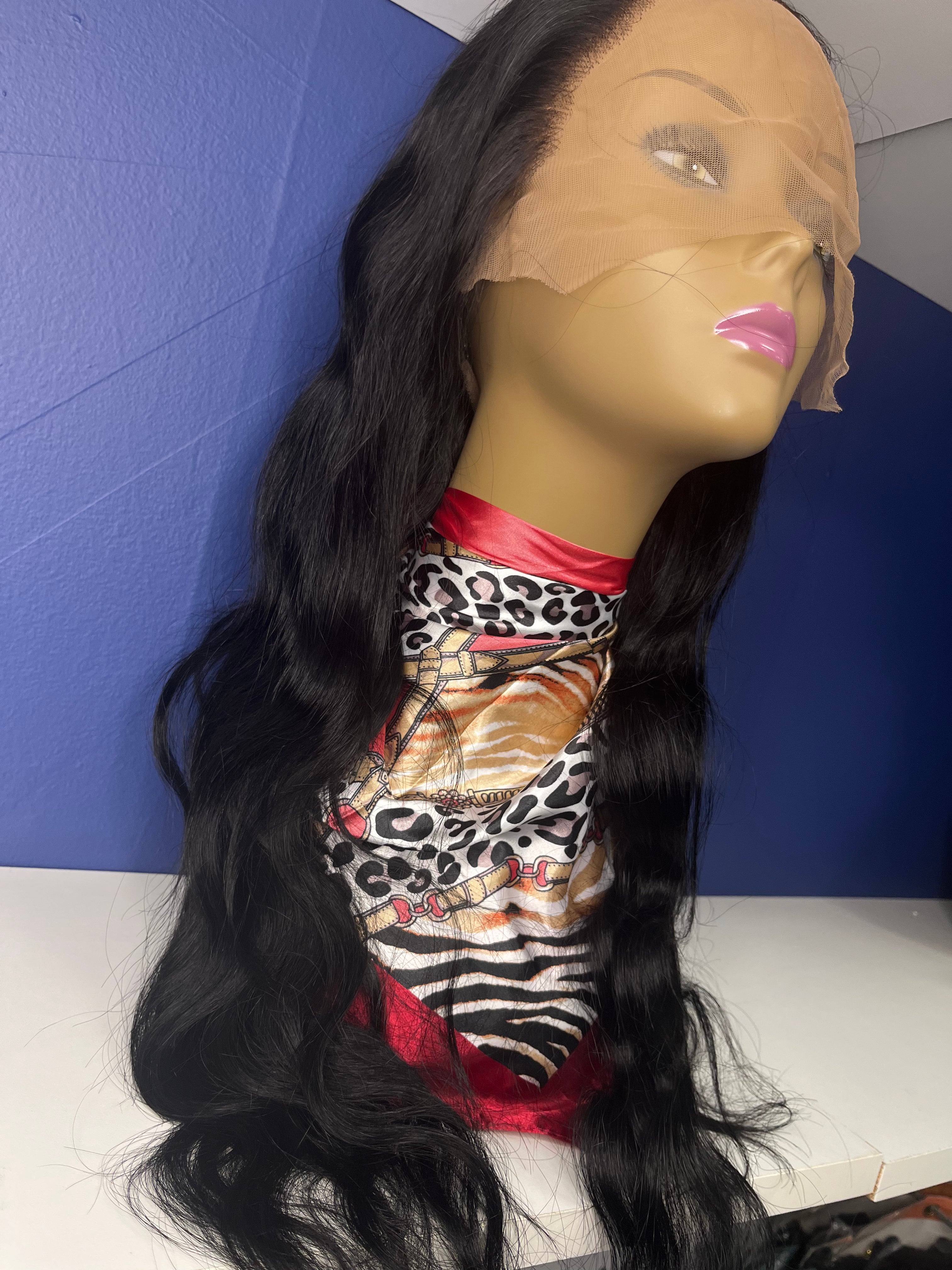 28 inch 13 by 4 preplucked prebleached gluless lace wig 100% human virgin Indian hair on mannequin sitting on white shelf with blue background