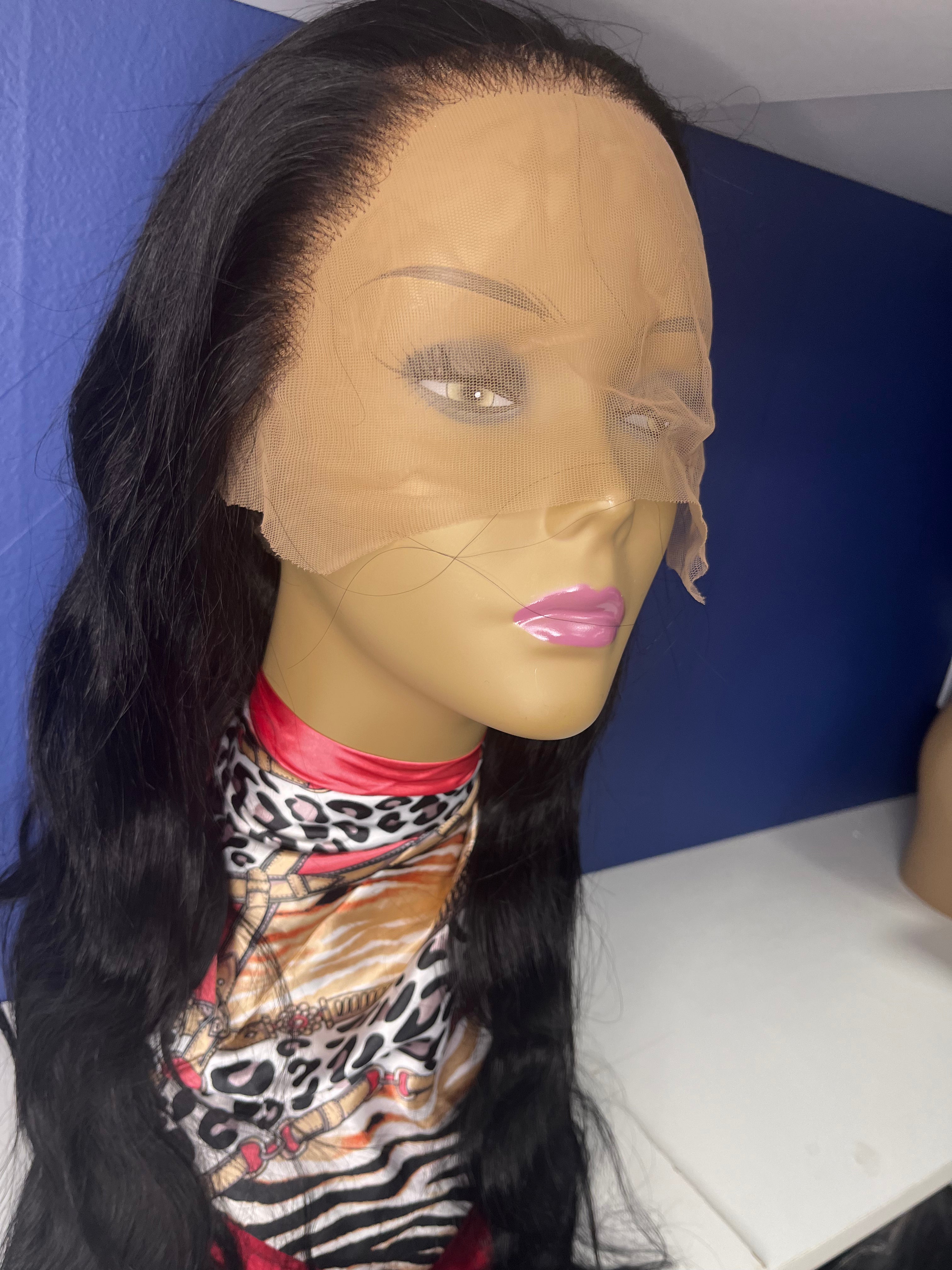 28 inch 13 by 4 preplucked prebleached gluless lace wig 100% human virgin Indian hair on mannequin sitting on white shelf with blue background