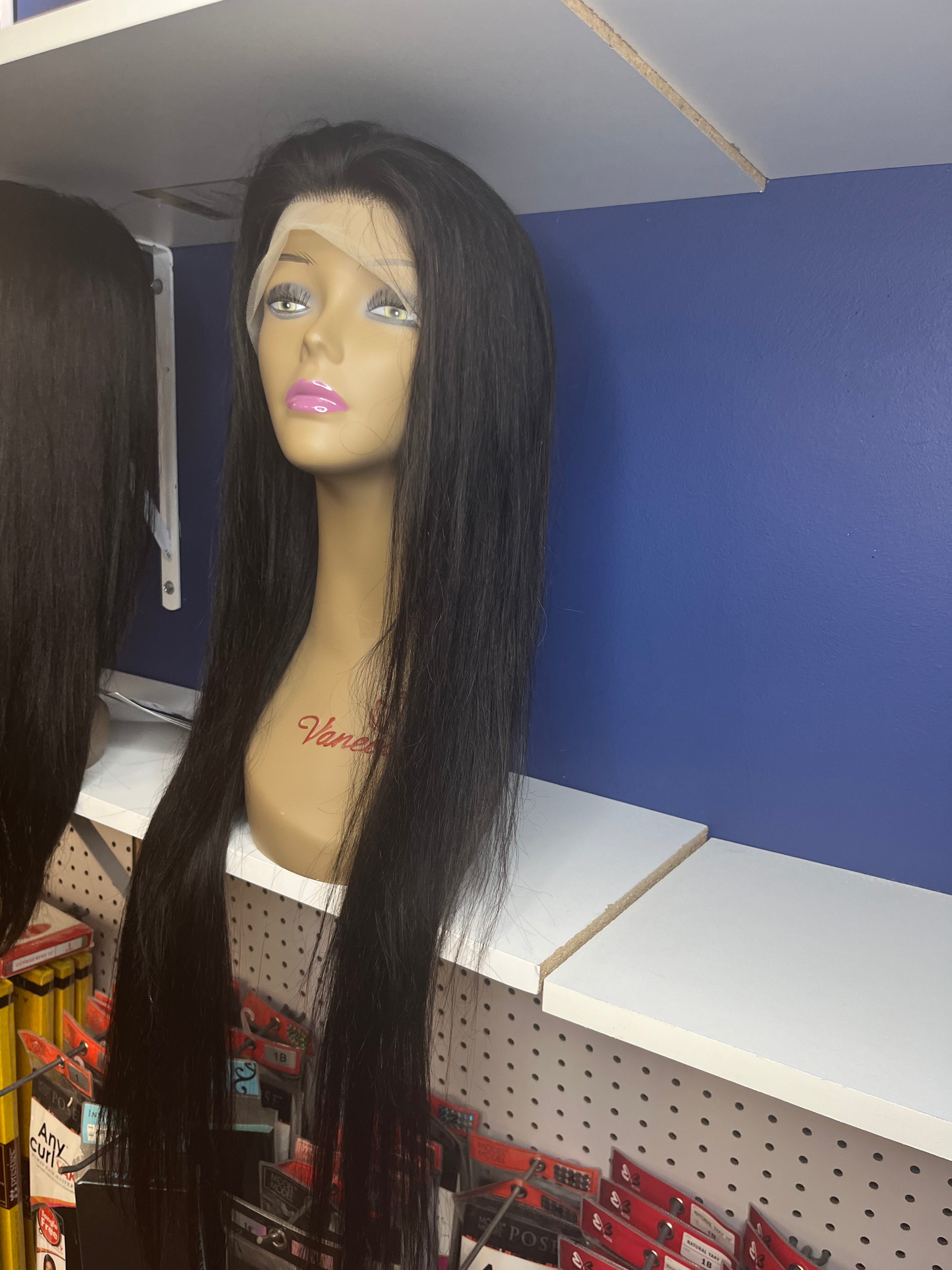 13 by 4 virgin hair straight glueless HD lace wig 30 inches preplucked on a mannequin sitting on a white shelf with a blue background