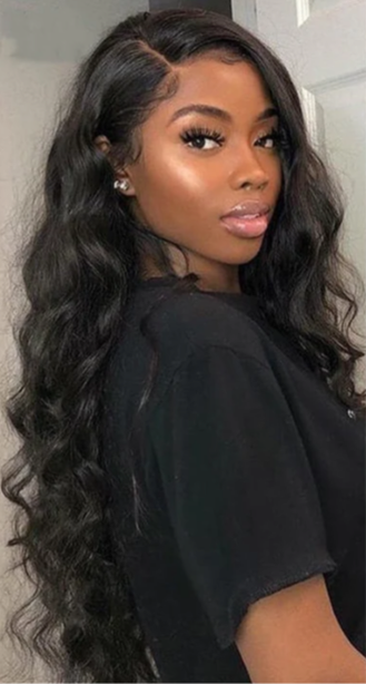 Pretty woman wearing virgin body wave bundles Standing in front of a white background wearing a black t-shirt